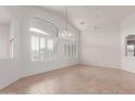 Spacious living area with tile flooring, ample natural light, and neutral color palette providing a versatile space at 4617 W Alicia Dr, Laveen, AZ 85339