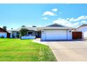 Charming single-story home with a well-manicured lawn and two-car garage, perfect for suburban living at 5634 N 39Th Ave, Phoenix, AZ 85019