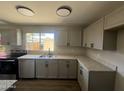 Well-lit kitchen showcasing stainless steel appliances, granite countertops, and ample cabinet space at 5723 N 44Th Ln, Glendale, AZ 85301
