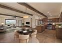Open-concept living space featuring recessed lighting, hardwood floors, ceiling fan, and an adjacent kitchen at 6602 E Heather Dr, Mesa, AZ 85215
