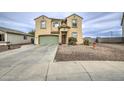 Two-story home showcasing a well-maintained front yard, and a green garage door at 703 N Redwood Ln, Buckeye, AZ 85326