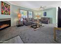 Spacious living room with fireplace, comfortable seating, and stylish decor at 750 E Northern Ave # 2088, Phoenix, AZ 85020