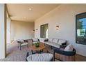 Inviting covered patio featuring comfortable seating, modern lighting, and stylish design at 8501 E Appaloosa Trl, Scottsdale, AZ 85258