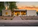 Stunning single-story home with clean lines, desert landscaping, and a welcoming entrance walkway at 8501 E Appaloosa Trl, Scottsdale, AZ 85258