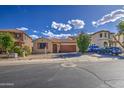 Beautiful single-story home with desert landscaping, a two-car garage, and a well-maintained lawn at 9413 W Williams St, Tolleson, AZ 85353