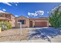 Lovely single-Gathering home showcasing desert landscaping, a two-car garage, and a well-manicured yard at 9413 W Williams St, Tolleson, AZ 85353