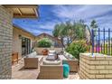 Inviting back patio area with comfortable seating, a stylish stone floor, and a partial view of the backyard at 964 Leisure World --, Mesa, AZ 85206