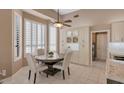 Charming breakfast nook featuring built-in cabinetry and views of the backyard at 10907 E Bella Vista Dr, Scottsdale, AZ 85259