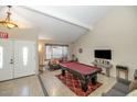 Inviting living room with a billiard table, neutral walls, and a cozy seating area at 17819 N 46Th Dr, Glendale, AZ 85308