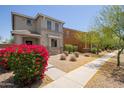 Attractive two-story home featuring low maintenance landscaping, stone accents, and desert foliage at 20045 N 49Th Dr, Glendale, AZ 85308