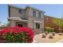 Inviting two-story home with stone accents, low maintenance landscaping, and desert foliage at 20045 N 49Th Dr, Glendale, AZ 85308