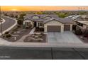 Aerial view of a single-story home with desert landscaping, and a two-car garage at 20506 N 271St Ave, Buckeye, AZ 85396