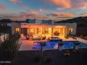 Inviting backyard with a pool, spa, fire pit, and covered patio, perfect for outdoor entertaining at 2609 W Lavitt Ln, Phoenix, AZ 85086
