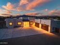 Stunning desert home featuring a large driveway and a spacious three-car garage at 2609 W Lavitt Ln, Phoenix, AZ 85086
