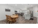 Open concept space blends the living and dining area seamlessly, creating an airy and inviting atmosphere at 2923 W Shanley Ave, Apache Junction, AZ 85120