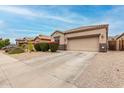 Charming desert home featuring a two-car garage, easy-care landscaping, and a neutral color scheme at 3022 W Redwood Ln, Phoenix, AZ 85045