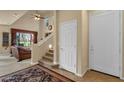 Bright foyer with staircase, high ceilings, tile flooring, and stylish rug at 3131 E Legacy Dr # 1057, Phoenix, AZ 85042