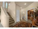 Inviting foyer with staircase, high ceilings, and doorways to other rooms at 3131 E Legacy Dr # 1057, Phoenix, AZ 85042