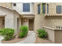 Inviting front entrance with desert landscaping, tiled roof, and covered entryway at 3131 E Legacy Dr # 1057, Phoenix, AZ 85042