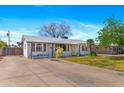 Lovely single-Gathering home with a spacious driveway and beautifully landscaped front yard at 3243 E Sheridan St, Phoenix, AZ 85008