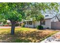 Well-kept home with mature trees shading the front yard at 3243 E Sheridan St, Phoenix, AZ 85008