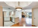 Open living area with hardwood floors, a fireplace, and a seamless flow to the kitchen at 4850 E Desert Cove Ave # 240, Scottsdale, AZ 85254