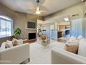 Spacious living room features wood floors, gas fireplace, open to the kitchen and dining areas at 5335 E Shea Blvd # 2045, Scottsdale, AZ 85254