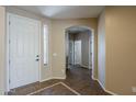Open foyer featuring tile flooring and an arched entryway, creating a welcoming entrance at 5926 W Questa Dr, Glendale, AZ 85310