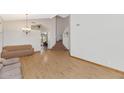 Spacious living room with hardwood floors leading to a staircase at 648 W Cobblestone Dr, Casa Grande, AZ 85122