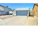 Charming single-story home with a gray and white exterior, a two-car garage, and a well-kept yard at 6826 S 16Th Way, Phoenix, AZ 85042
