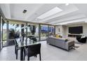 Open concept living and dining room with floor-to-ceiling windows and fireplace at 7137 E Rancho Vista Dr # 6011, Scottsdale, AZ 85251
