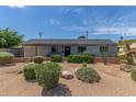 Charming single-story home with desert landscaping, providing a low-maintenance and attractive exterior at 7727 E 4Th St, Scottsdale, AZ 85251