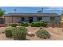 Charming single-story home with desert landscaping, providing a low-maintenance and attractive exterior at 7727 E 4Th St, Scottsdale, AZ 85251