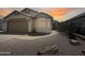 Inviting single-story house featuring low-maintenance desert rock landscaping at 8339 W Bluefield Ave, Peoria, AZ 85382