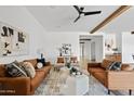 Bright living room features hardwood floors, modern décor, and comfortable seating at 10134 E Talon Ave, Mesa, AZ 85212