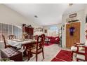 Inviting living room and dining area featuring plush carpets, plenty of light, and comfortable seating at 10320 W Luke Ave, Glendale, AZ 85307
