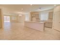 Open floor plan featuring a kitchen with stainless appliances and expansive island with lots of room for entertaining at 1122 E Meadowbrook Dr, Casa Grande, AZ 85122
