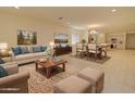 Spacious and stylish living room with elegant furnishings and a dining area at 1122 E Meadowbrook Dr, Casa Grande, AZ 85122