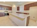 Modern kitchen showcasing stainless steel appliances, granite countertops, and wooden cabinets at 1130 E Atwood Dr, Casa Grande, AZ 85122