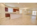 This kitchen features a large island, granite countertops, and stainless steel appliances at 1142 E Atwood Dr, Casa Grande, AZ 85122