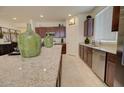 Bright kitchen with granite countertops, stainless appliances, and lots of storage space in rich wood cabinets at 1142 E Atwood Dr, Casa Grande, AZ 85122