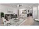 Open-concept living area flowing into kitchen with a modern aesthetic and comfortable seating at 1202 E Binner Dr, Chandler, AZ 85225