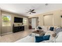 Comfortable living room with a large TV, neutral tones, and an inviting sectional sofa at 1202 E Binner Dr, Chandler, AZ 85225