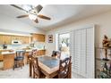 Dining area featuring a ceiling fan and sliding doors leading to an outdoor patio space at 1289 Leisure World --, Mesa, AZ 85206
