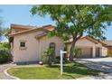 Charming two-story home with a three car garage, lush landscaping, and mature shade tree at 1360 S Camellia Ct, Chandler, AZ 85286