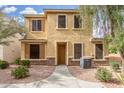 Inviting two-story home featuring a well-maintained yard and a welcoming entrance, perfect for Gathering living at 14907 N 177Th Ave, Surprise, AZ 85388