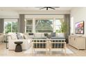 Bright and airy living room showcasing comfortable seating, contemporary decor, and large windows offering natural light at 16934 W Bronco Trl, Surprise, AZ 85387