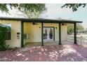 Covered outdoor patio featuring brick flooring and ceiling fans for comfortable relaxation at 17730 E Brooks Farm Rd, Gilbert, AZ 85298