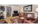 Comfortable living room with stylish decor, large TV, and seamless flow to other living spaces at 1916 W Morningside Dr # 108, Phoenix, AZ 85023