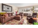 Comfortable living room with stylish decor, a cozy sofa, and ample natural light at 1916 W Morningside Dr # 108, Phoenix, AZ 85023
